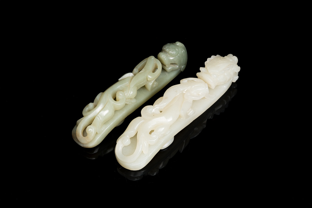 Two Chinese white and celadon jade belt hooks, Qing
