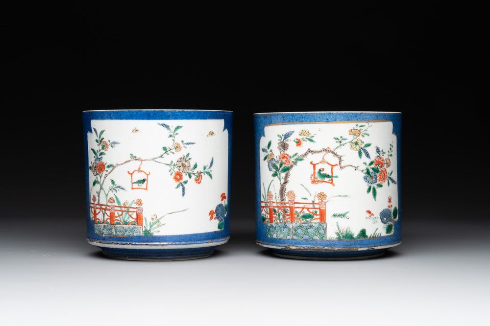 A pair of Chinese powder blue-ground famille verte vessels with a bird in a garden, Kangxi