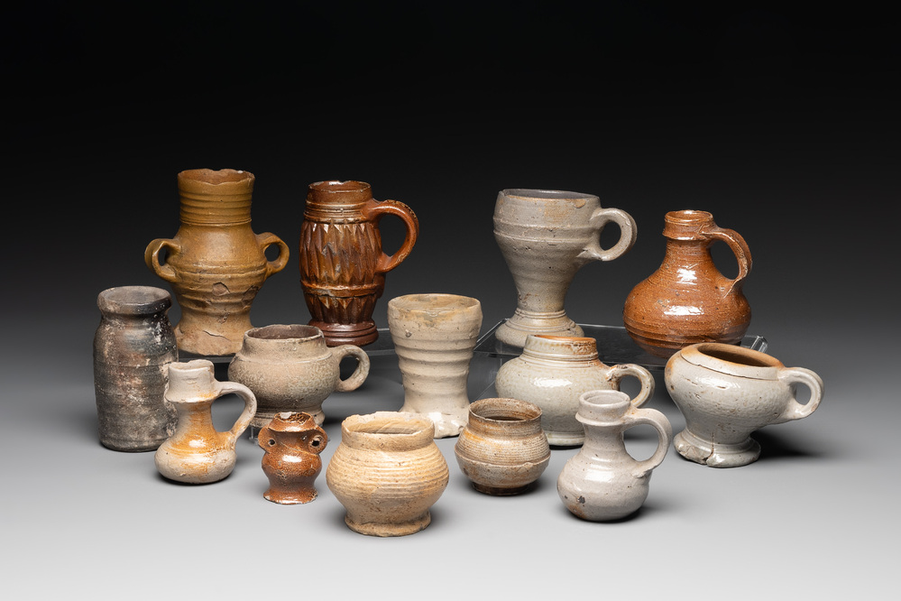 14 German stoneware jugs, mugs and vessels, 14/16th C.
