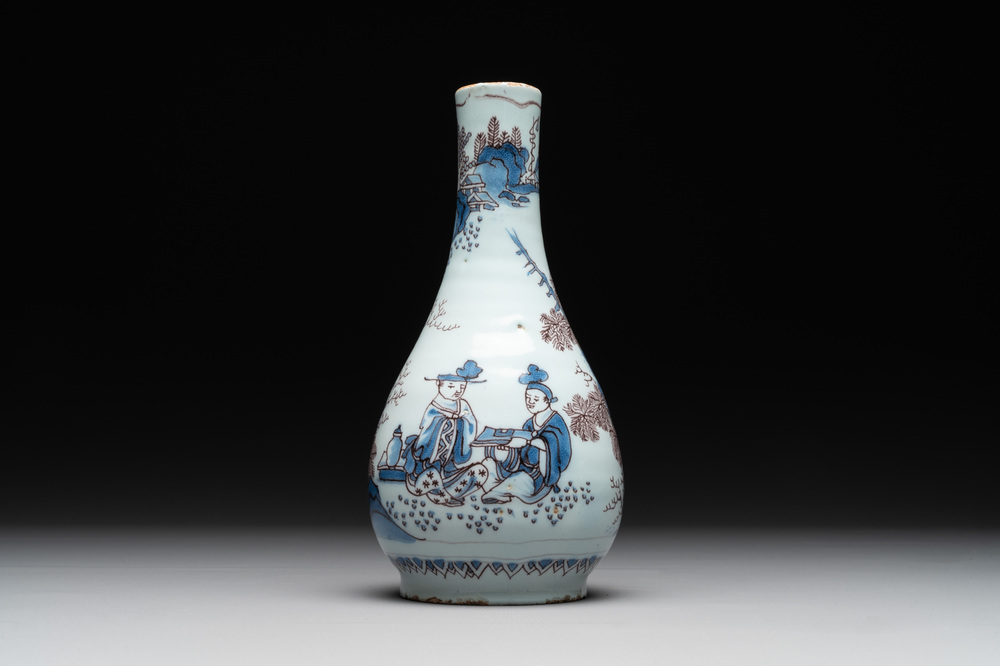 A Dutch Delft blue, white and manganese chinoiserie bottle vase, late 17th C.