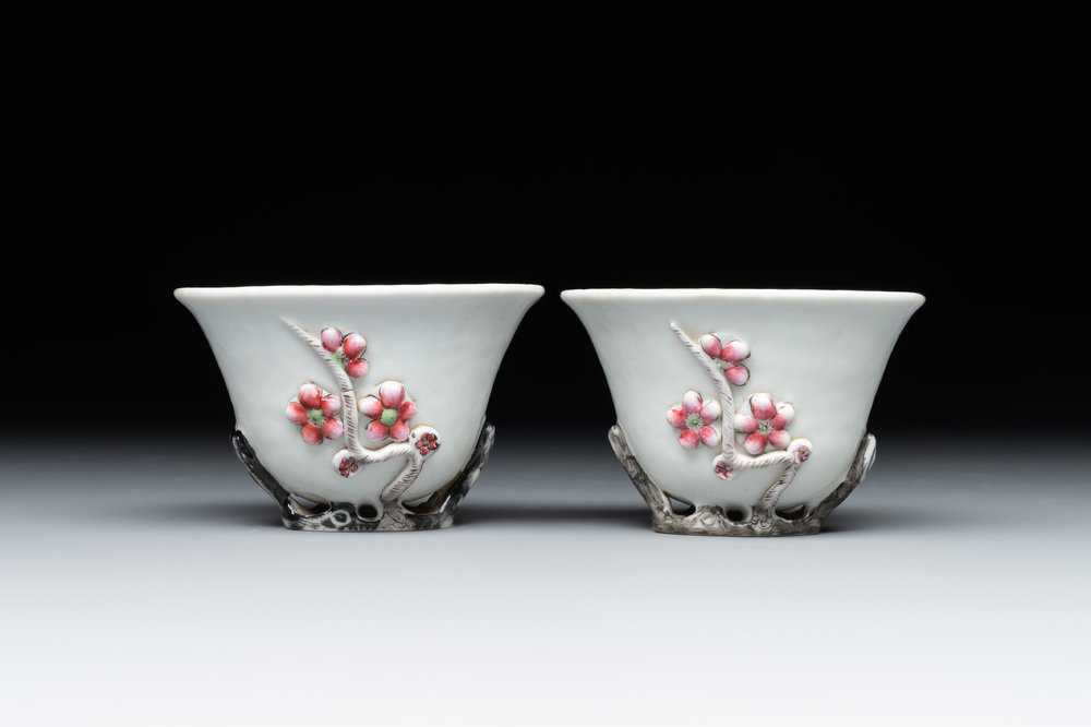 A pair of Chinese Dehua blanc de Chine relief-decorated famille rose 'prunus' cups, 19th C.
