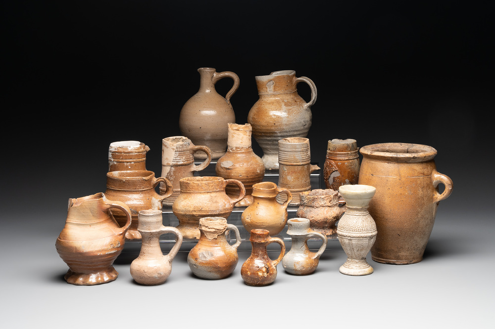18 German stoneware jugs, mugs and vessels, 15th C. and later