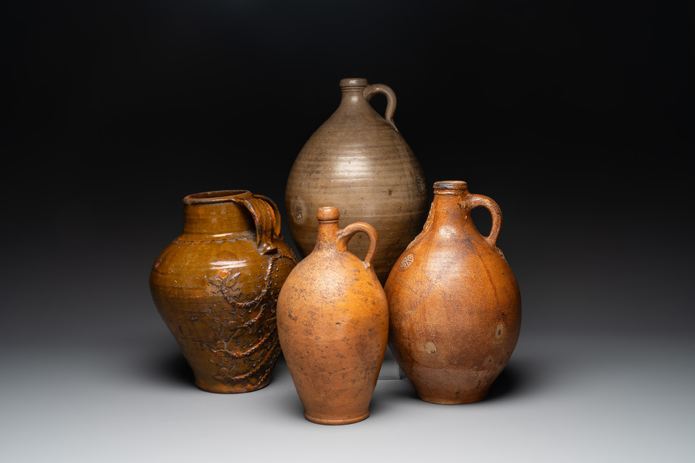 Three German stoneware jugs, including a bellarmine, and a French or English pottery jug, 17th C. and later