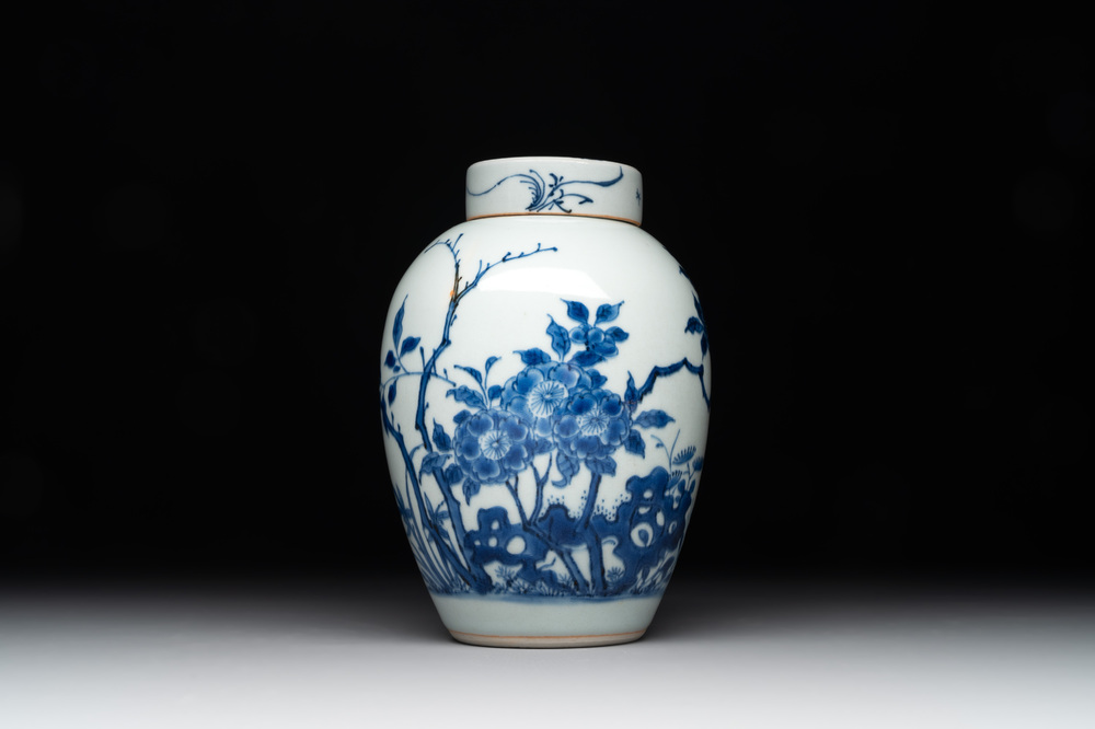 A Chinese blue and white jar and cover with birds among flowering branches, Transitional period