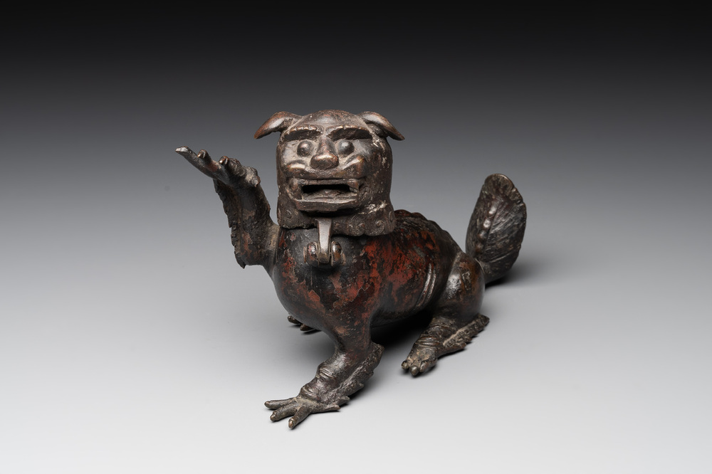 A rare Chinese bronze lion-form incense burner and cover, Song/Ming