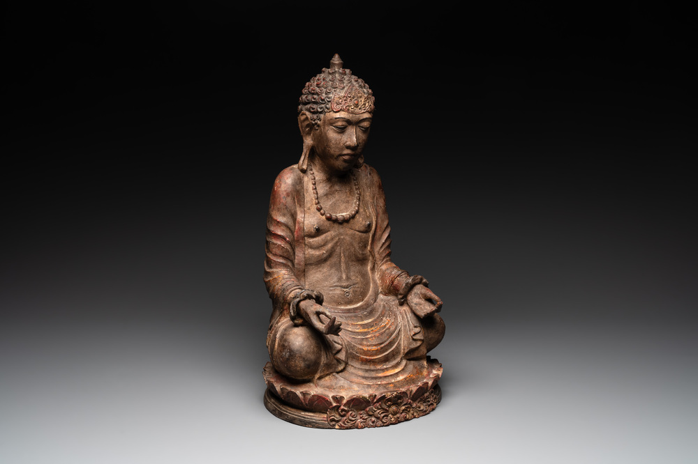 A Southeast Asian gilt-lacquered wooden sculpture of a praying ascetic, 18/19th C.