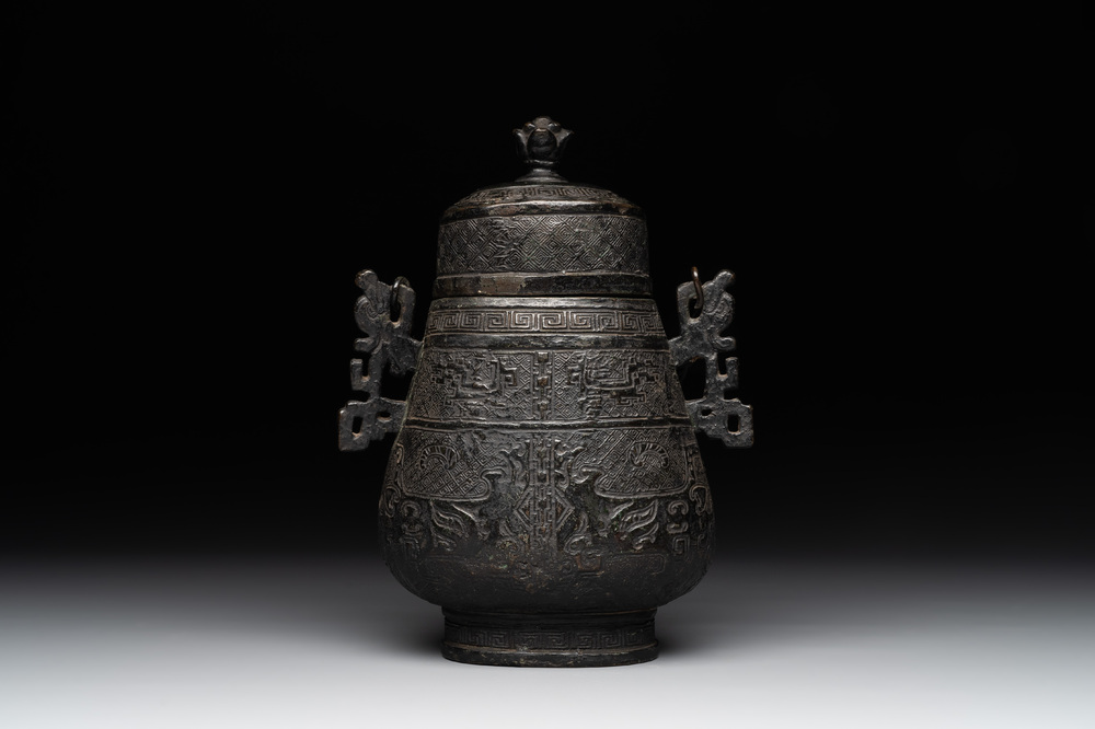 A Chinese archaistic bronze 'Taotie' wine vessel and cover, 'you 卣', Ming