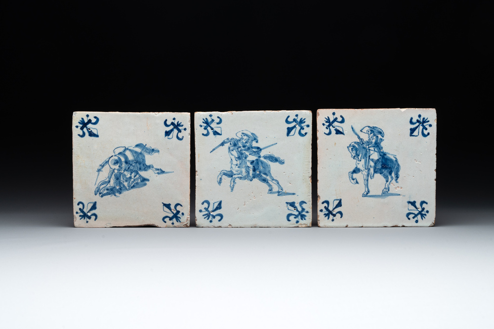 Three blue and white Dutch Delft 'horserider' tiles, 17th C.