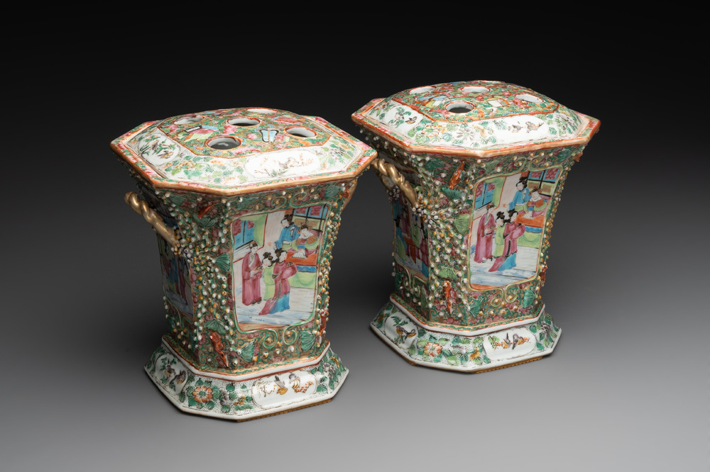 A pair of Chinese Canton famille rose flower holders and covers with figural design, 19th C.