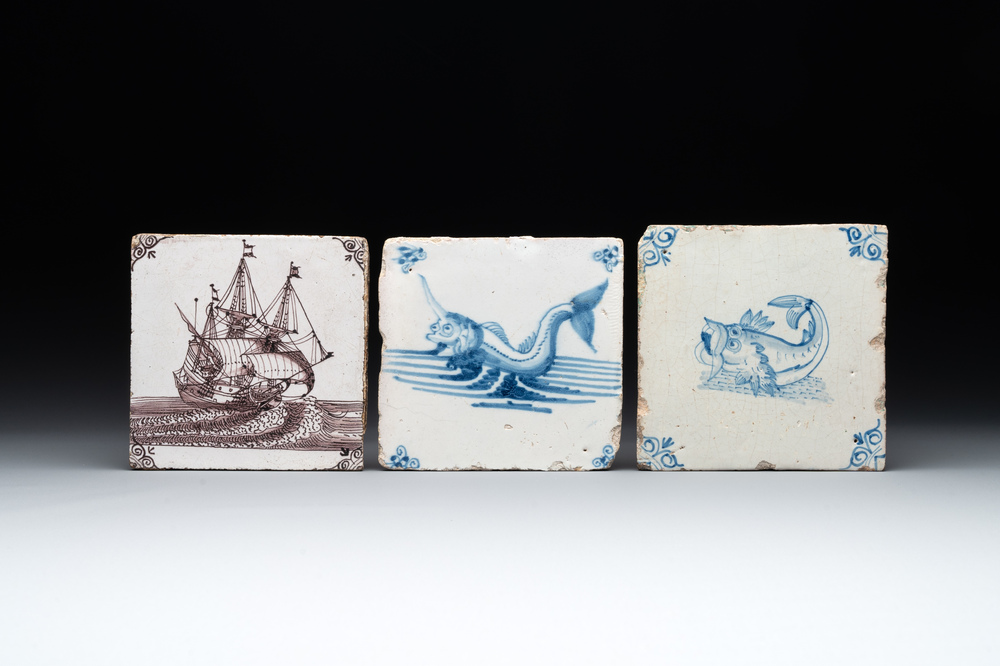Two blue and white Dutch Delft 'sea monster' tiles and a manganese 'ship' tile, 17/18th C.