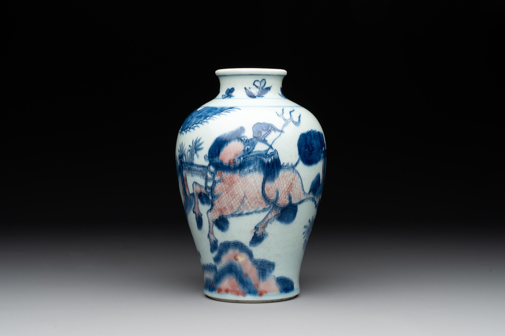 A Chinese blue, white and copper-red 'kylin and phoenix' vase, 19th C.