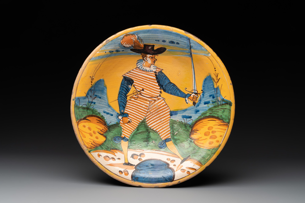 An Italian maiolica dish with a swordsman, Montelupo, early 17th C.
