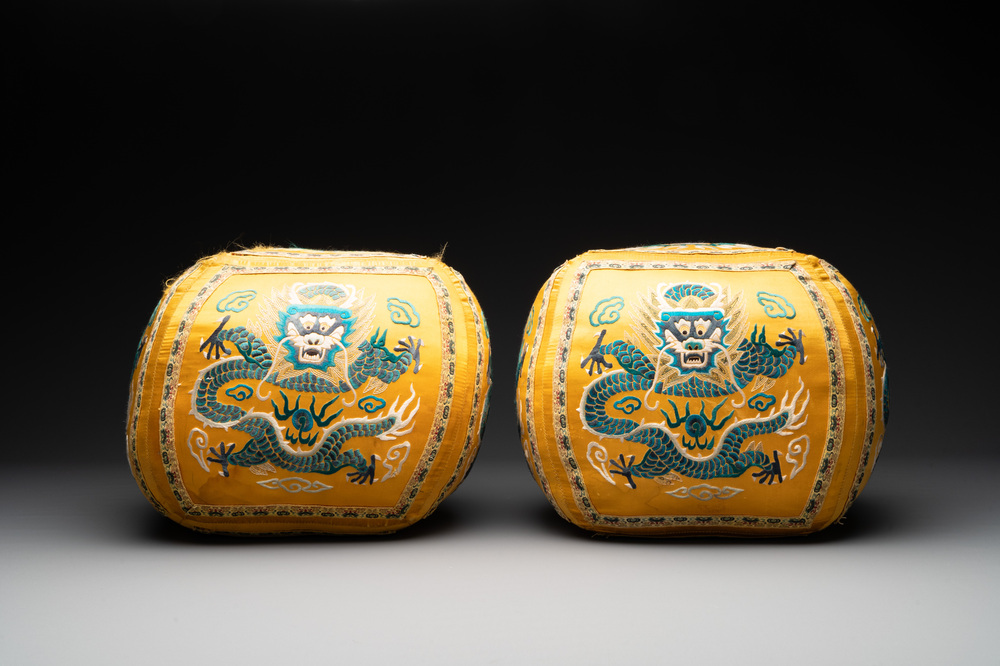A pair of Chinese yellow-ground embroidered silk 'dragon' cushions, 19th C.