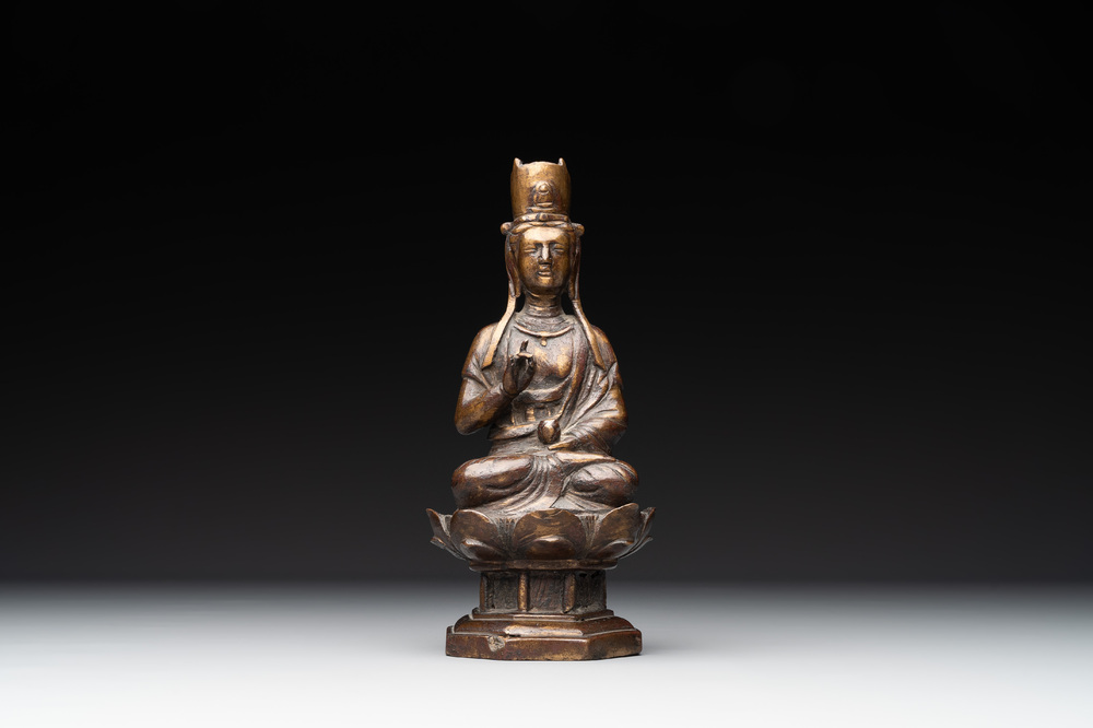 A Chinese bronze seated Guanyin on a lotus throne, probably Liao