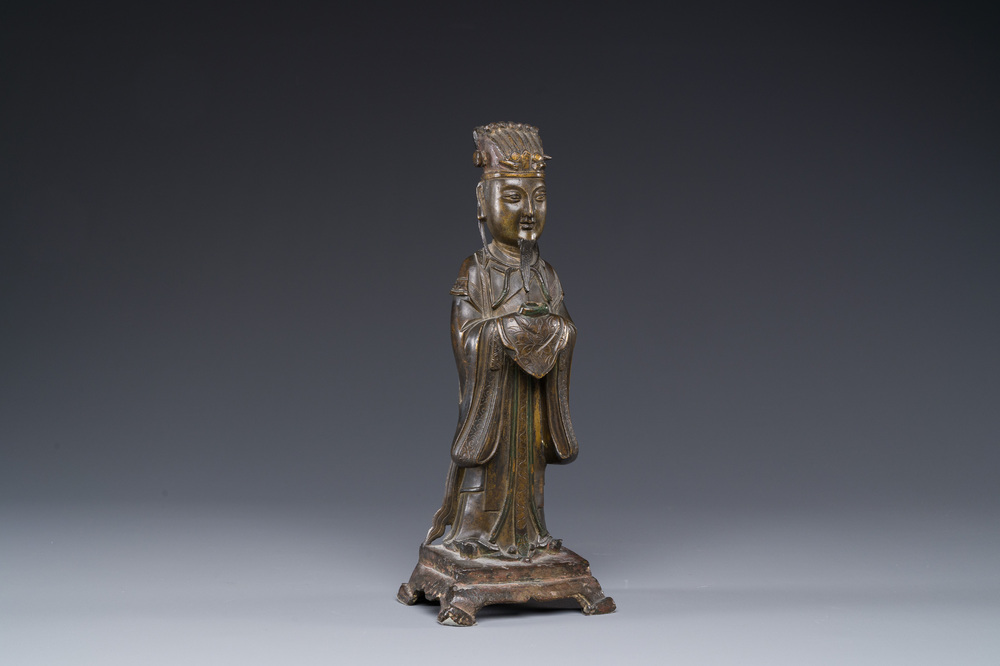A Chinese bronze figure of an official, Ming