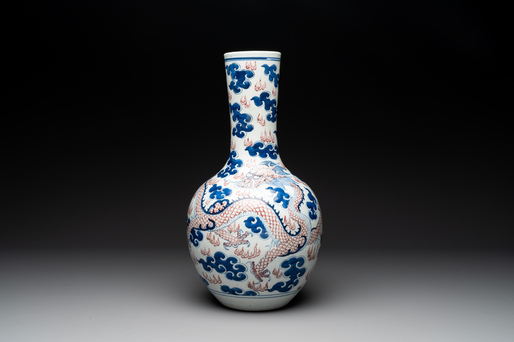 A Chinese blue, white and copper-red 'dragon and phoenix' vase, 19th C.