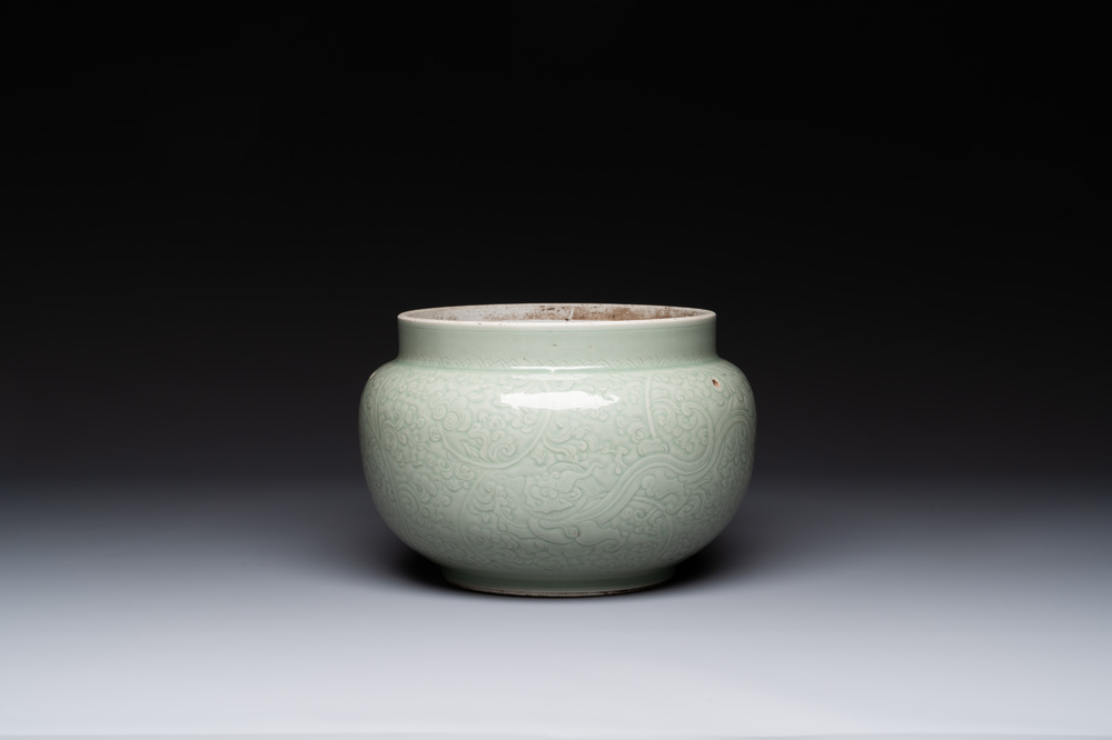 A Chinese incised celadon-glazed bowl with chilong and floral design, Kangxi