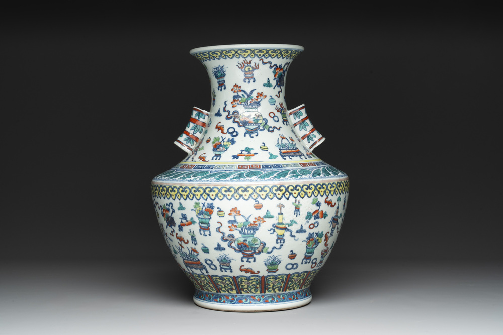 A Chinese doucai 'antiquities' 'hu' vase, Qianlong mark, 19th C.