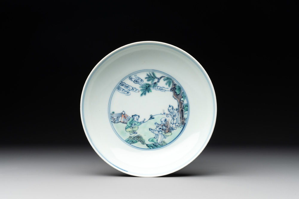A Chinese doucai 'playing boys' plate, Chenghua mark, 18th C.