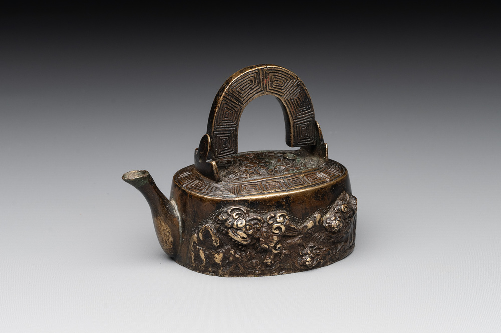 A Japanese bronze 'shishi lions' water dropper, Meiji, 19th C.