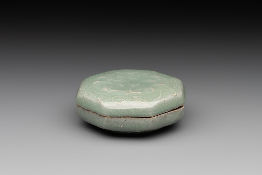 A Chinese Longquan celadon box and cover with anhua peony design, Song