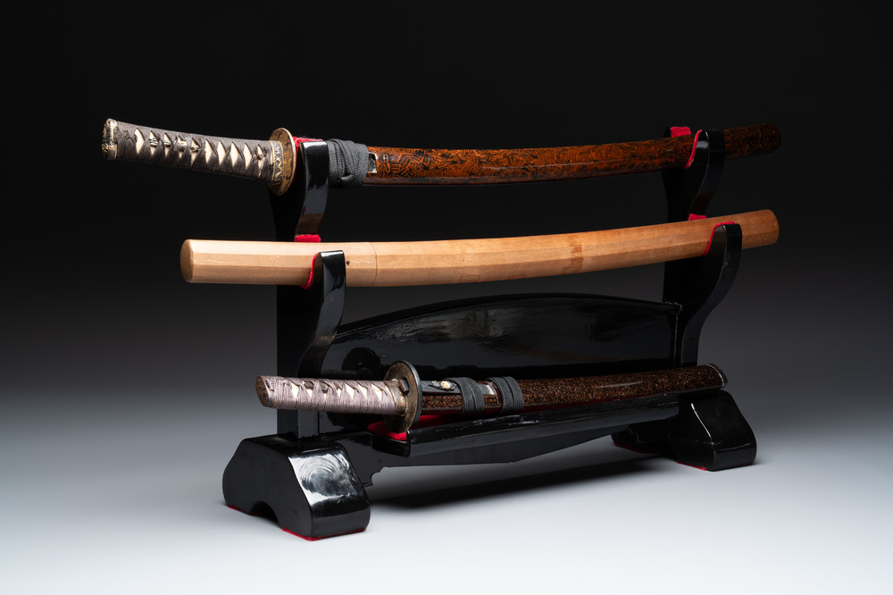 A collection of fine Japanese sword handles, guards, sheaths, a sword and a lacquered stand, Edo, 18/19th C.