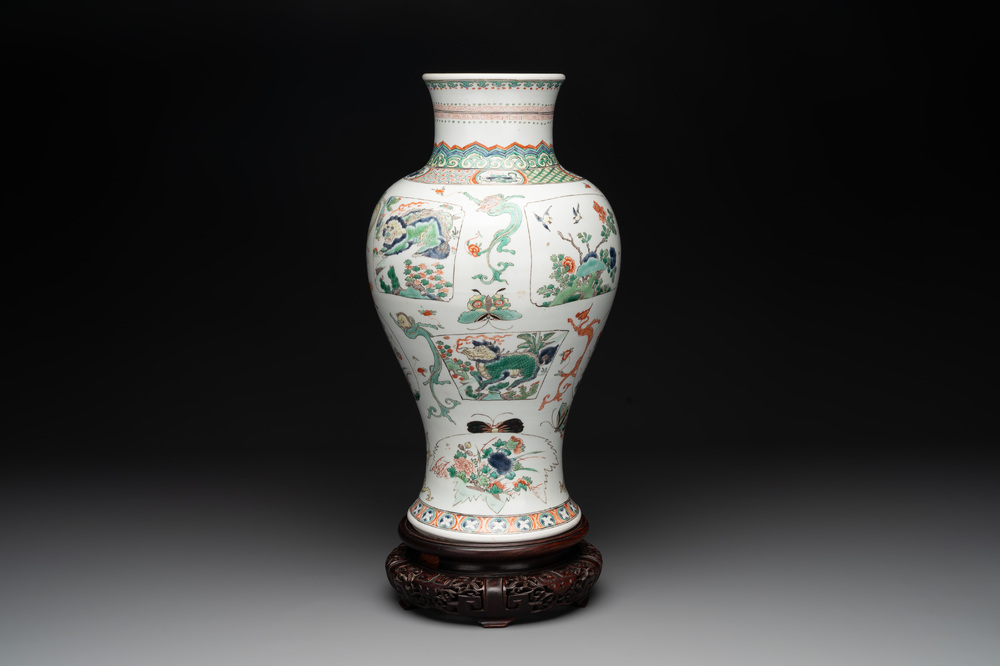 A fine Chinese famille verte 'mythical creatures' vase on a reticulated wooden stand, Kangxi