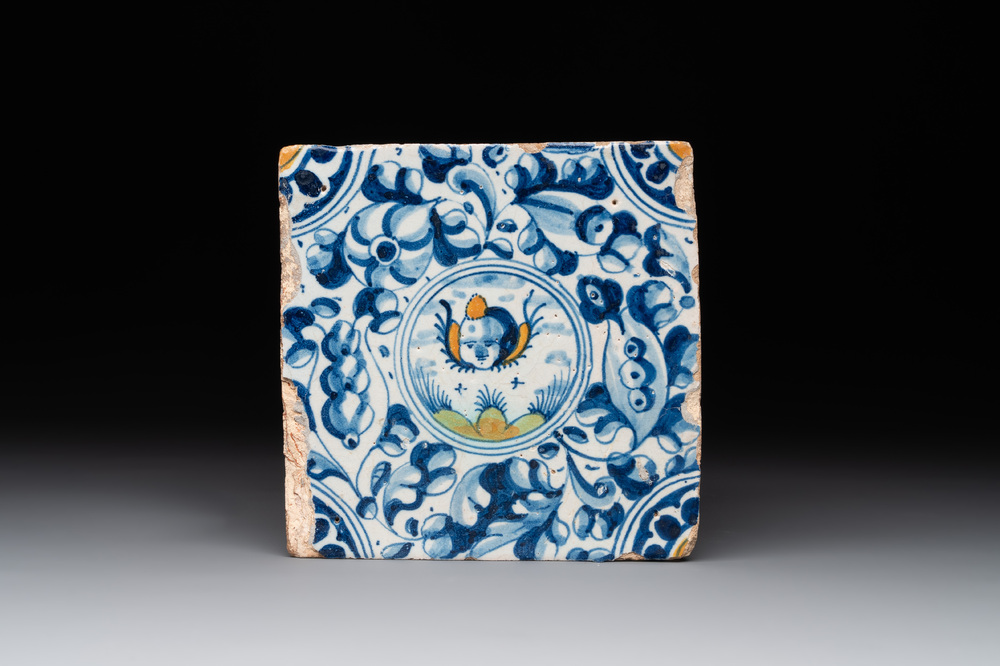 A fine Dutch Delft polychrome maiolica tile with a cherub, ca. 1600
