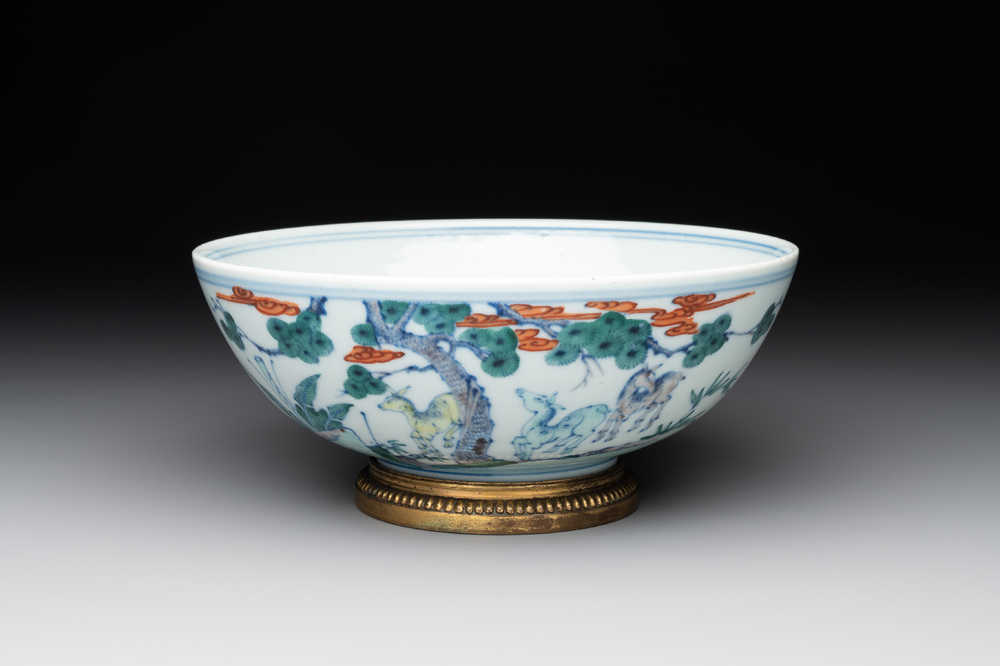 A Chinese doucai 'deer' bowl with gilt bronze stand, Chenghua mark, 18th C.