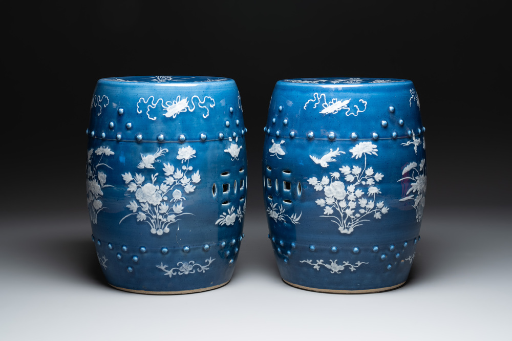 A pair of Chinese white slip-decorated blue-ground garden seats, 19th C.