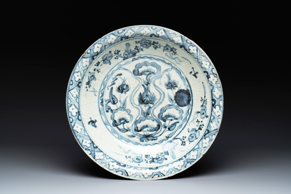 A Chinese Swatow blue and white dish with stylised floral design, Ming