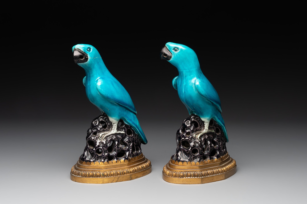 A pair of turquoise- and aubergine-glazed parrots with gilt bronze mounts, Kangxi