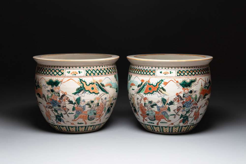 A pair of Chinese Nanking famille verte 'warriors' fish bowls, 19th C.