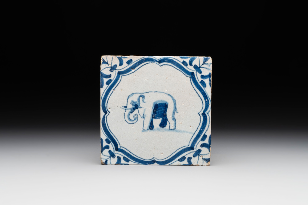 A blue and white Dutch Delft 'accolades border' 'elephant' tile, 17th C.