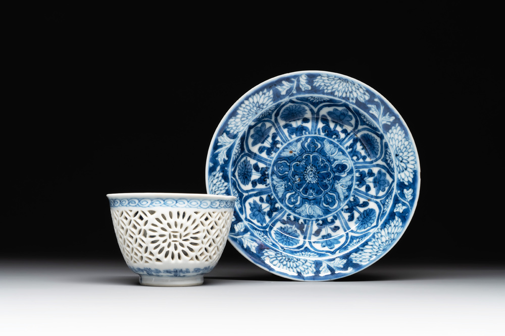 A Chinese blue and white reticulated double-walled cup and saucer, lingzhi mark, Kangxi