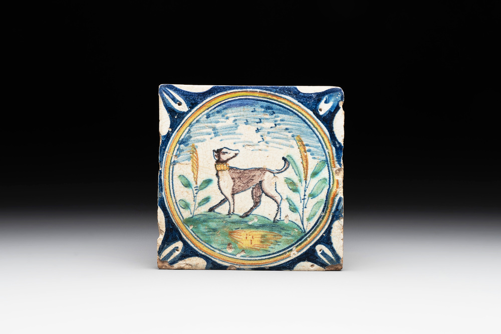 A polychrome Dutch Delft maiolica 'medallion' 'dog' tile, late 16th C.