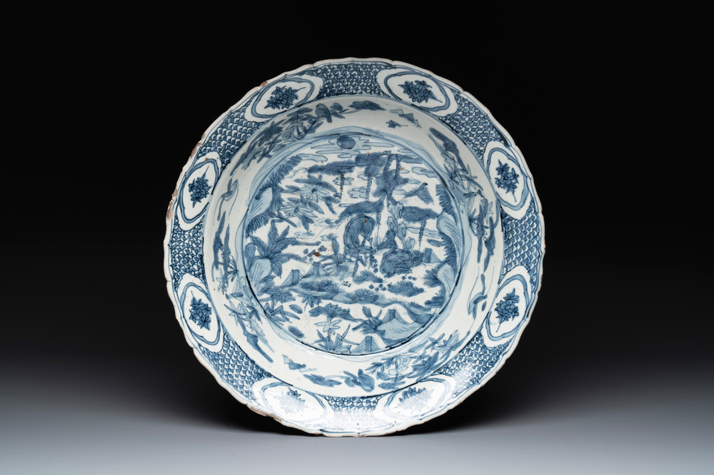 A Chinese Swatow blue and white dish with deer in a landscape, Ming