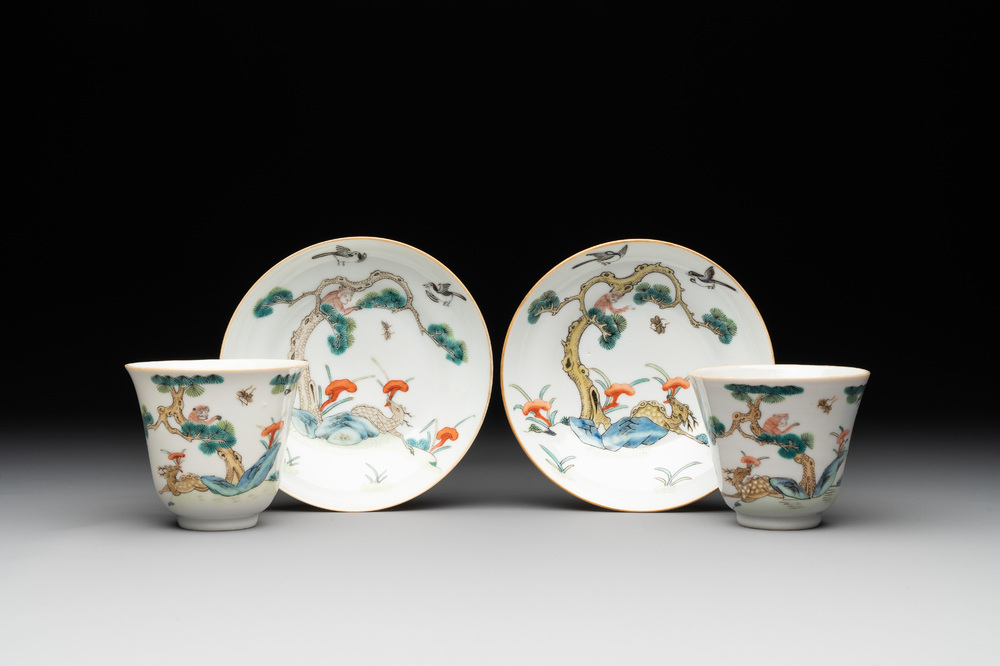 A pair of Chinese famille rose 'monkey and deer' cups and saucers, Tongzhi mark and of the period