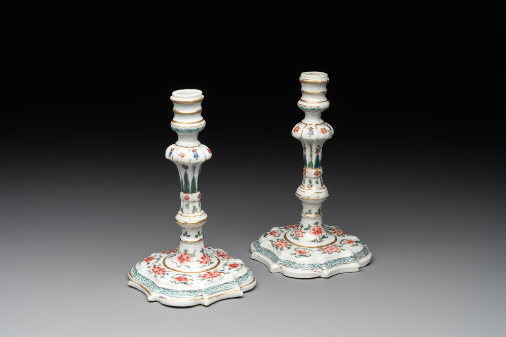 A pair of rare Chinese export famille rose candlesticks with floral design, Yongzheng/Qianlong