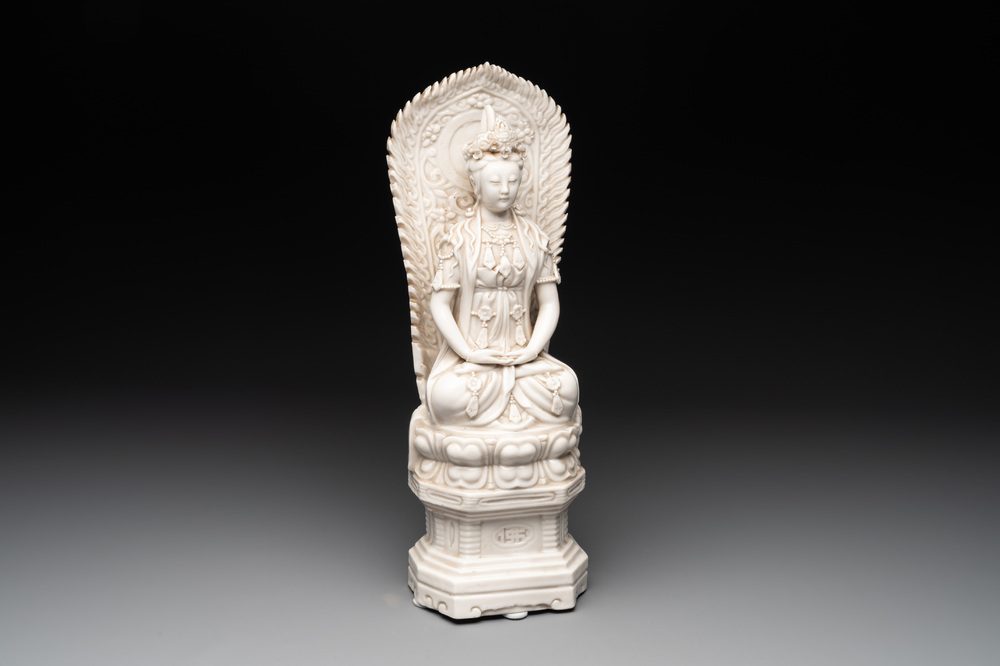 A Chinese Dehua blanc de Chine seated Guanyin, Qianlong mark, Republic