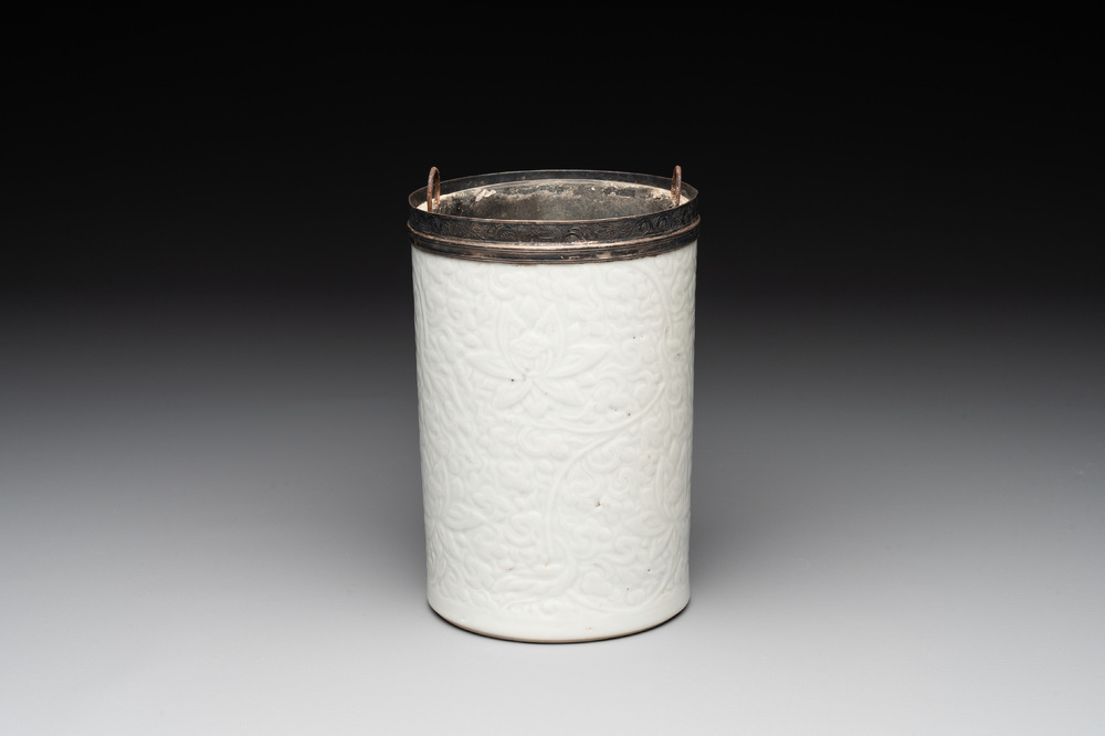 A Chinese silver mounted incised white-glazed 'lotus scroll' brush pot, Kangxi