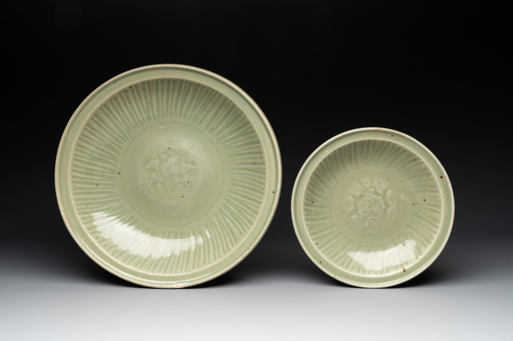 A Chinese Longquan celadon dish and a plate with floral design, Ming