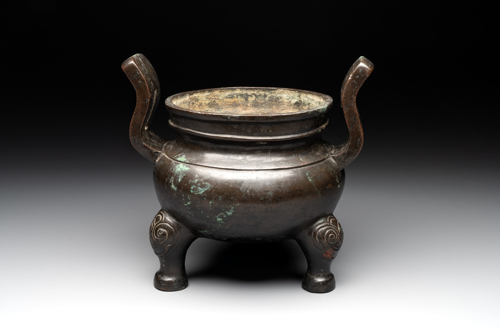 A Chinese bronze tripod censer with two handles, Ming