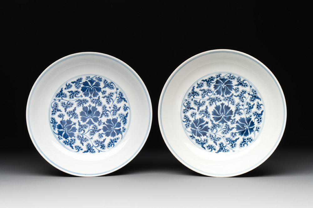 A pair of imperial Chinese blue and white 'lotus scroll' plates, Qianlong mark and of the period
