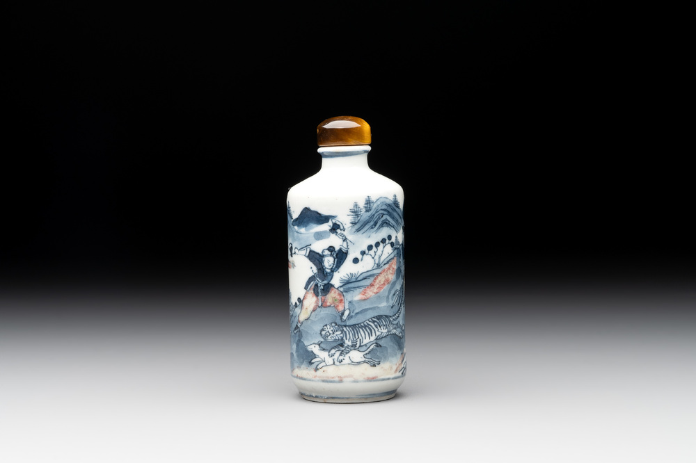 A Chinese blue, white and copper-red 'tiger hunt' snuff bottle, 19th C.
