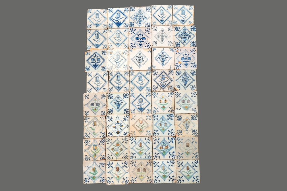 40 Dutch Delft blue, white and polychrome 'diamond' tiles with flowers, 17/18th C.