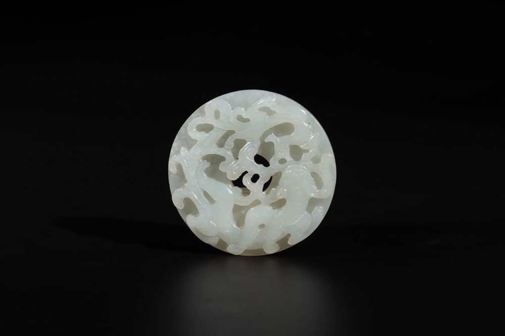 A Chinese white jade 'chilong' 'bi' disc, Qing
