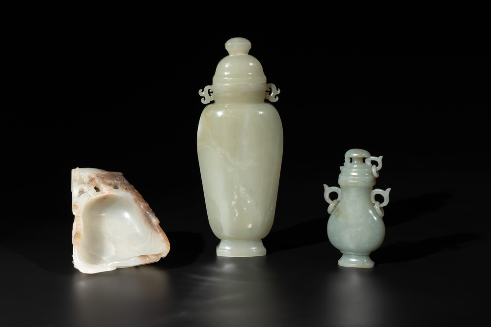A Chinese white and russet jade lotus-form brush washer and two covered vases, Qing
