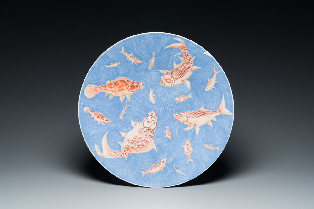 A large Chinese iron-red-decorated blue-ground 'carps' dish, 19th C.