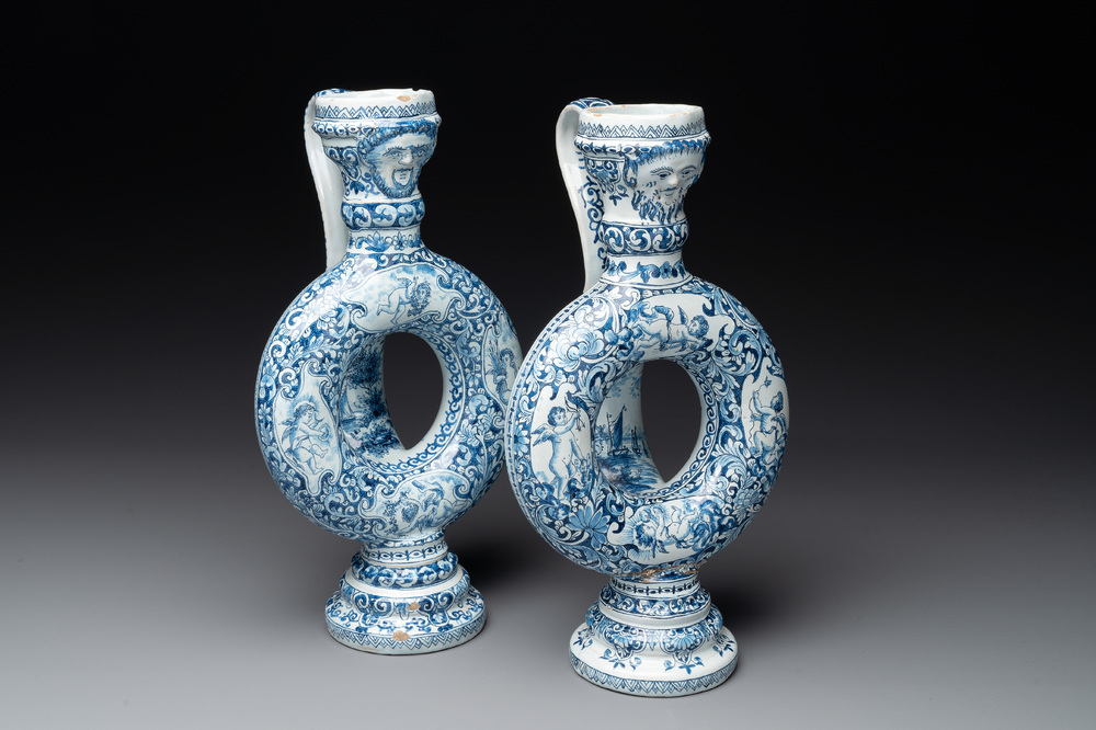 A pair of blue and white Dutch Delft circular jugs, 19th C.